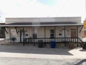 Back of property with a porch