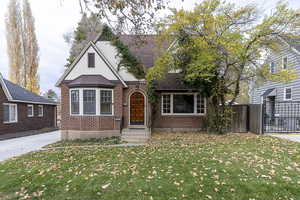 Tudor house with brick siding and roof with shingles