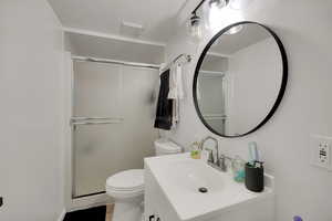 Full bathroom with a shower stall and vanity