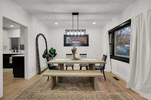 Dining room featuring light wood-style floors and recessed lighting
