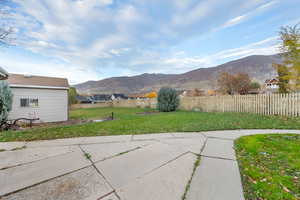 View of yard featuring a mountain view and a patio