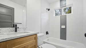 Bathroom with vanity and shower / bathtub combination