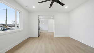 Unfurnished room with light wood finished floors, recessed lighting, and ceiling fan