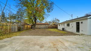 Fenced backyard with a patio