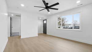 Spare room featuring light wood-type flooring, recessed lighting, and ceiling fan