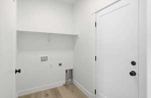 Laundry room with light wood-style flooring, washer hookup, and electric dryer hookup