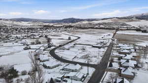 Snowy aerial view with a mountain view