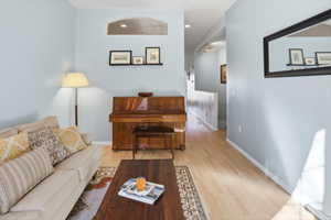 Living room featuring wood finished floors and recessed lighting