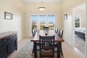 Dining space featuring light wood finished floors and baseboards