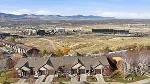 Aerial view of property's location featuring mountains