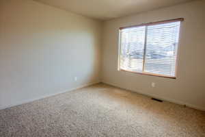 Bedroom featuring baseboards and carpet flooring