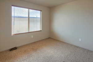 Carpeted bedroom with baseboards