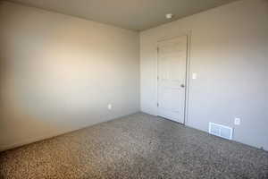Carpeted bedroom featuring baseboards