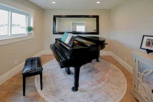 Living area featuring recessed lighting and light wood-type flooring