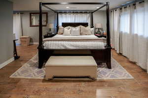 Bedroom featuring wood finished floors and recessed lighting