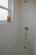 Bathroom featuring bathing tub / shower combination