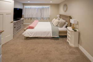 Bedroom featuring light colored carpet and recessed lighting