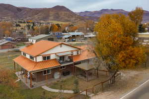 Aerial view of residential area featuring a mountainous background