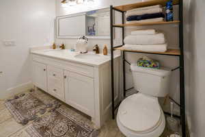 Bathroom with toilet and double vanity