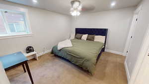 Bedroom with light colored carpet, a ceiling fan, and recessed lighting