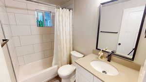 Bathroom featuring vanity and shower / tub combo