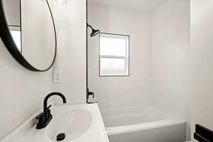 Full bathroom with vanity and  shower combination