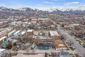 Aerial view of property's location with a mountainous background