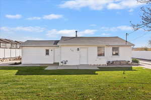 Back of property featuring a patio area and new landscaping