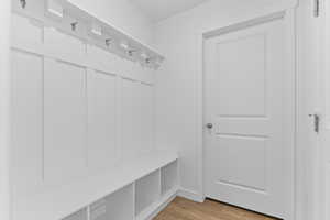 Mudroom featuring light wood-style floors