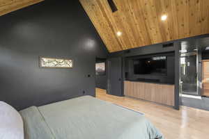 Bedroom with light wood finished floors, high vaulted ceiling, wooden ceiling, and recessed lighting