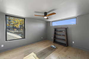 Spare room with light wood-style floors and ceiling fan
