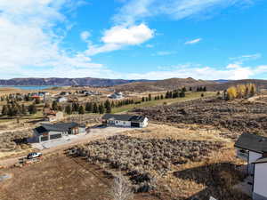 View of mountain backdrop with rural landscape