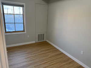 Bedroom with light wood-style floors