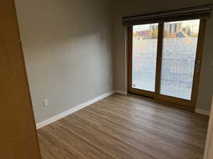 Bedroom featuring light wood-style flooring and baseboards