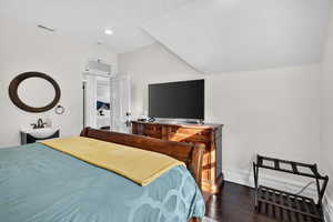Bedroom featuring dark wood-type flooring and recessed lighting