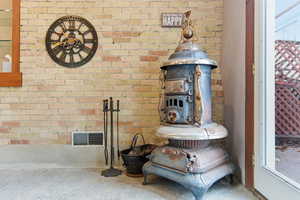 Detailed view of brick wall and a wood stove
