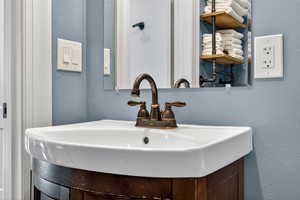 Bathroom view of a textured wall and vanity
