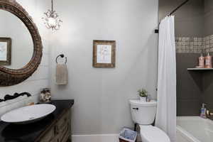 2nd Bathroom with vanity and shower / bath combination with curtain. Designer vanity.