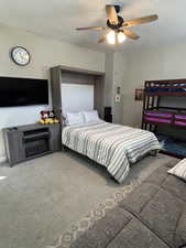3rd Bedroom, Murphy bed, Carpeted, with a textured ceiling and ceiling fan