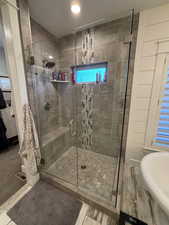 Full bath with a stall shower and recessed lighting