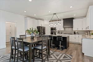 Dining room featuring recessed lighting and dark wood-type flooring