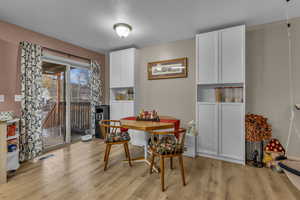 Dining area featuring light wood-type flooring