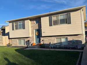 Bi-level home with brick siding and a mountain view