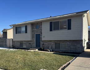 Bi-level home with brick siding
