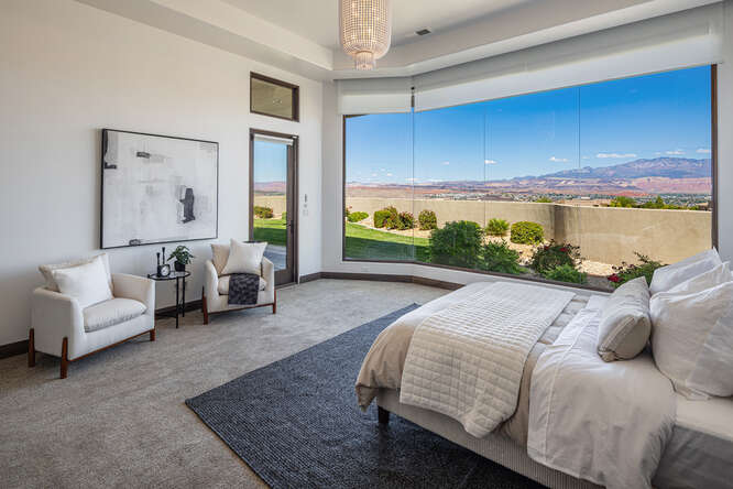 Bedroom with carpet and access to outside