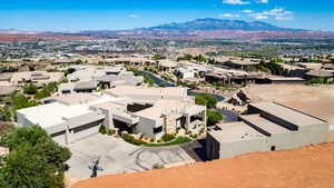 Aerial view of residential area featuring a mountainous background