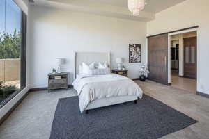 Carpeted bedroom featuring baseboards