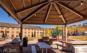 View of patio with an outdoor kitchen