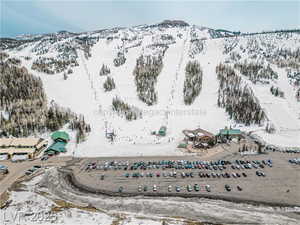 Snowy aerial view featuring a mountain view
