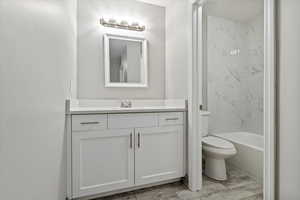 Full bath with vanity and bathtub / shower combination